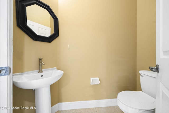 bathroom with tile patterned floors and toilet