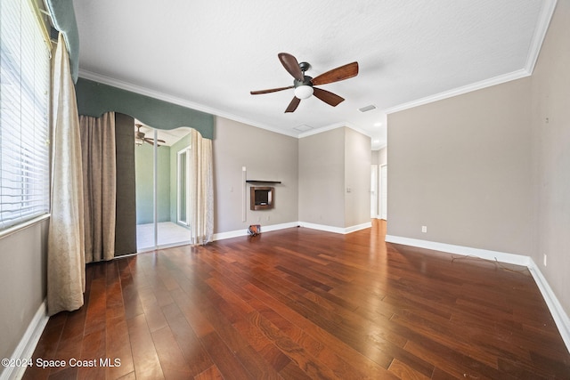 unfurnished living room featuring a textured ceiling, ceiling fan, dark hardwood / wood-style flooring, and crown molding