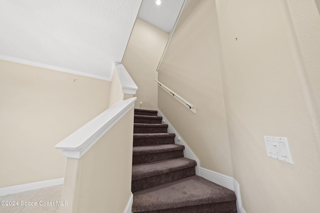 stairs with tile patterned flooring