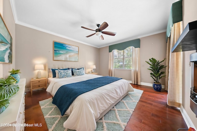 bedroom with ceiling fan, dark hardwood / wood-style floors, and crown molding