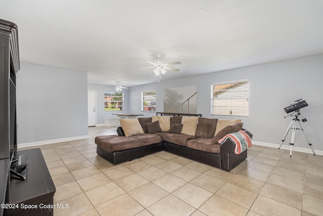 tiled living room featuring ceiling fan