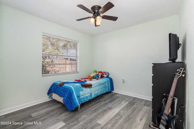 bedroom featuring hardwood / wood-style flooring and ceiling fan