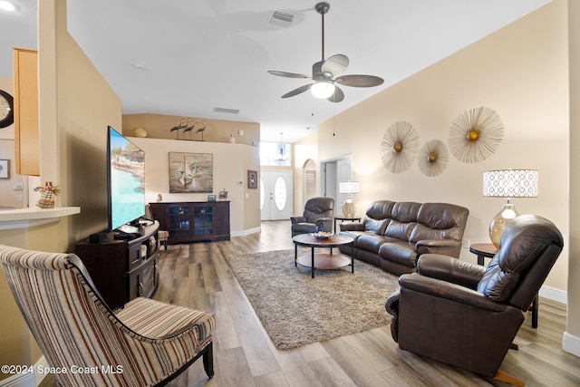 living room with hardwood / wood-style floors and ceiling fan