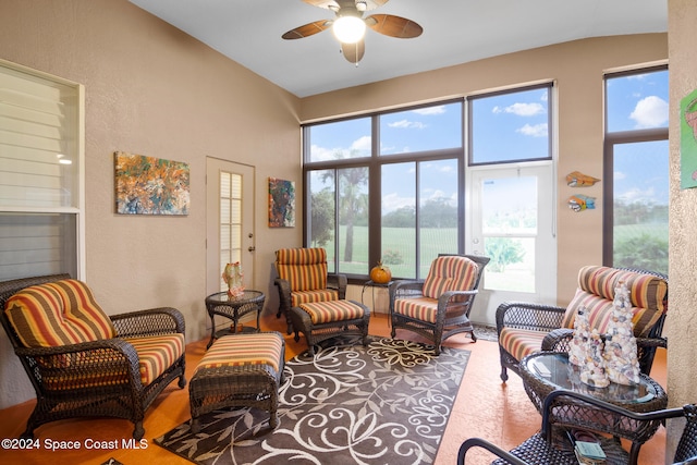 sitting room featuring vaulted ceiling, ceiling fan, and plenty of natural light