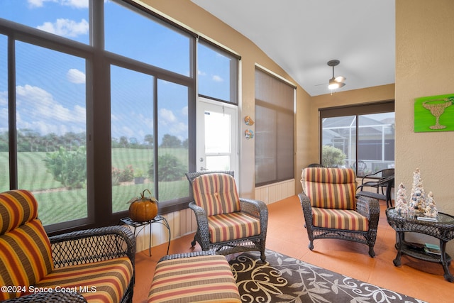 sunroom / solarium featuring a wealth of natural light and vaulted ceiling