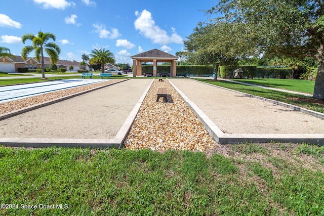 view of home's community with a lawn