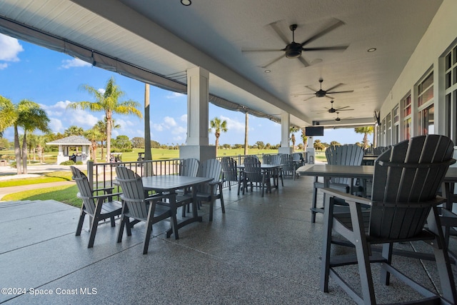 view of patio featuring ceiling fan