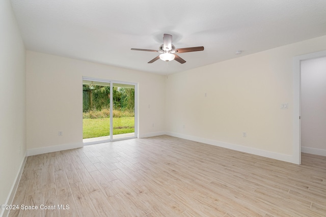 empty room with light hardwood / wood-style flooring and ceiling fan