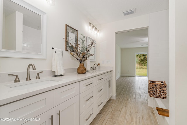 bathroom featuring vanity and hardwood / wood-style flooring