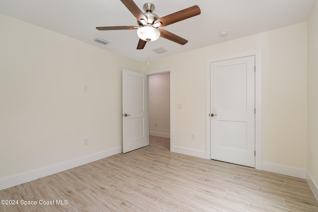 unfurnished bedroom with light wood-type flooring and ceiling fan