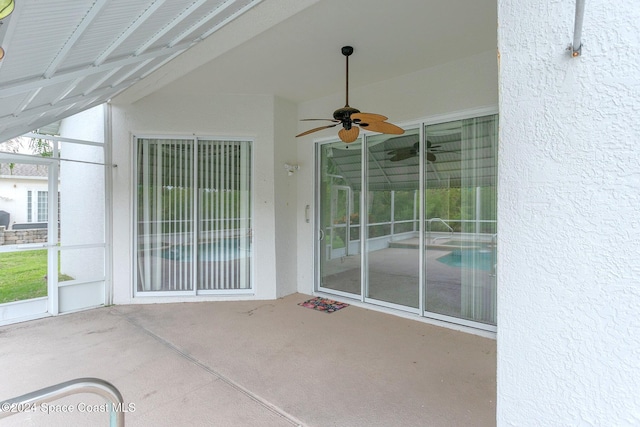 view of patio featuring ceiling fan