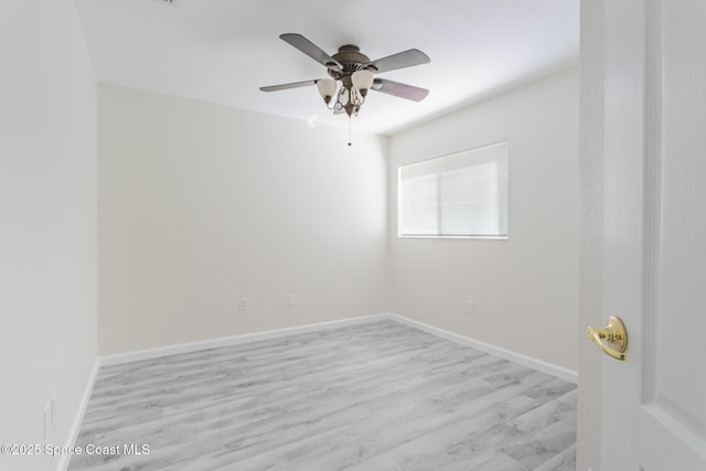 unfurnished room featuring a ceiling fan, light wood-style flooring, and baseboards