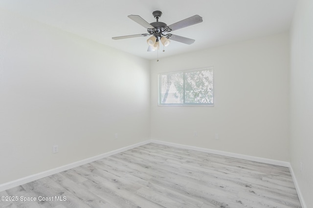 unfurnished room with light wood-style floors, ceiling fan, and baseboards