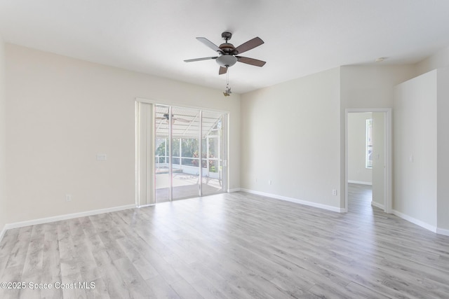 empty room featuring light wood-style floors, baseboards, and a ceiling fan