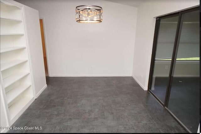 hallway featuring an inviting chandelier