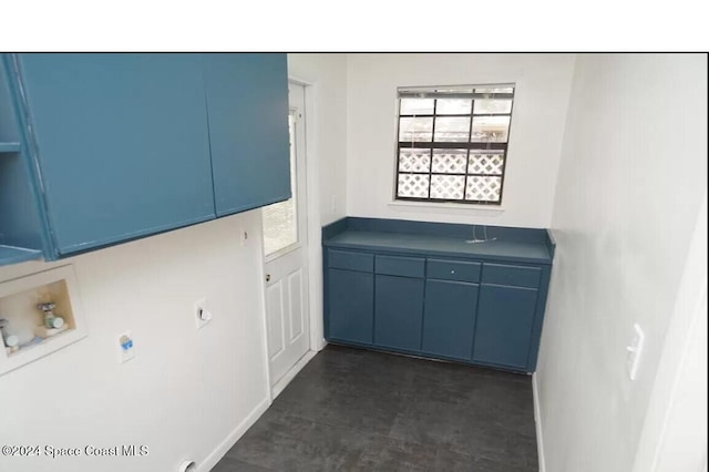 clothes washing area featuring electric dryer hookup, cabinets, and washer hookup