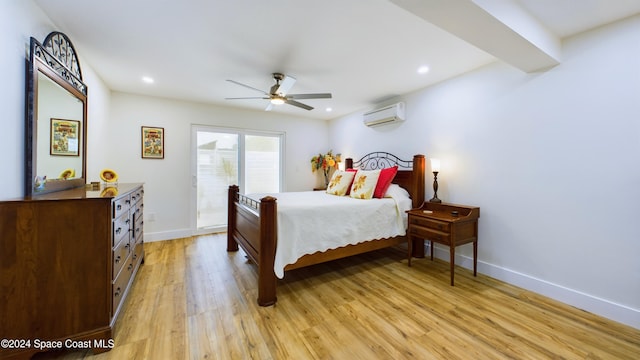 bedroom featuring access to exterior, light wood-type flooring, ceiling fan, and a wall mounted air conditioner