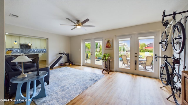 interior space featuring french doors, a wealth of natural light, and light wood-type flooring