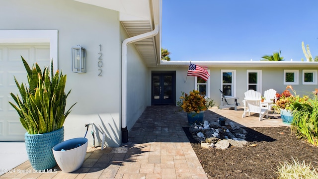 property entrance featuring a patio