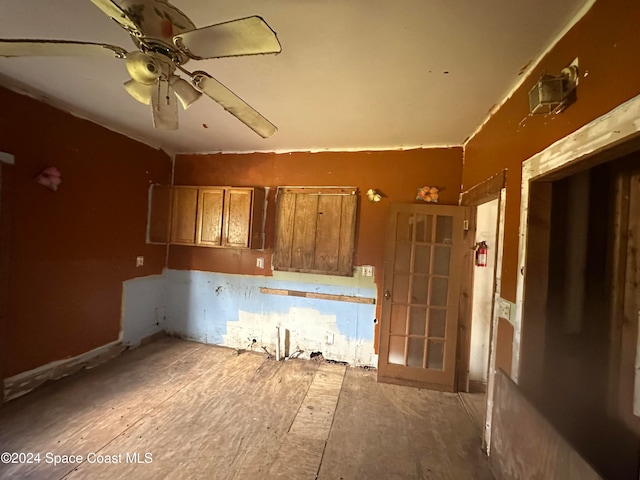 kitchen with brown cabinets and ceiling fan