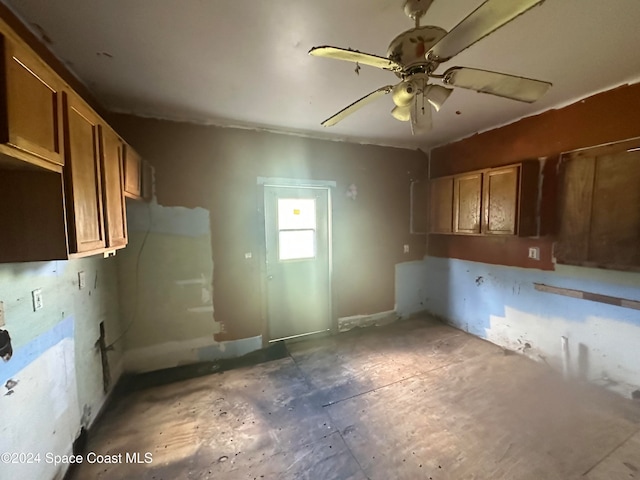 kitchen with brown cabinets and a ceiling fan