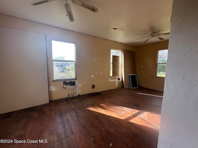 spare room with a ceiling fan and wood-type flooring