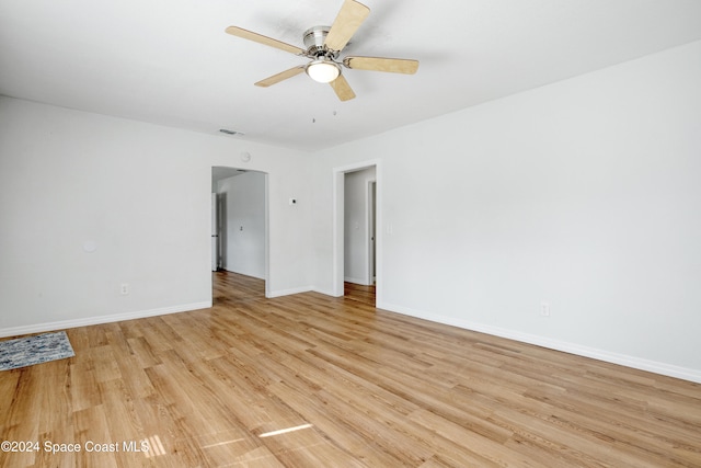 unfurnished room featuring ceiling fan and light wood-type flooring