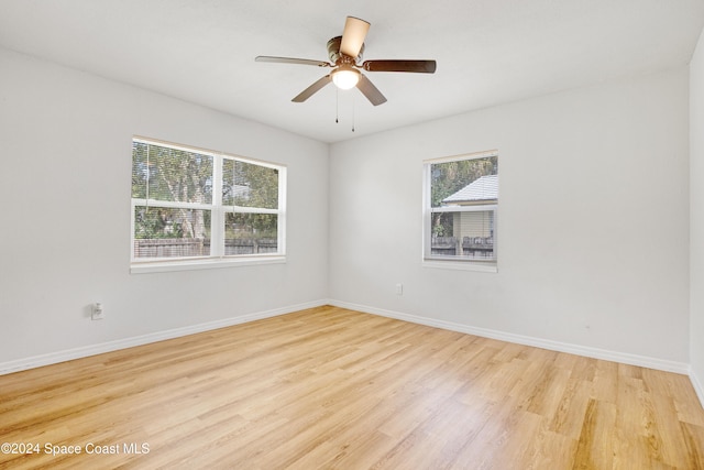 empty room featuring light wood-type flooring and ceiling fan