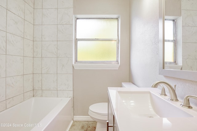 bathroom featuring tile patterned floors, vanity, and toilet