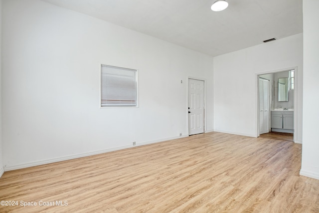 spare room with light hardwood / wood-style floors