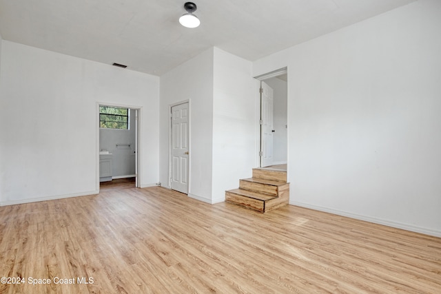 spare room with light wood-type flooring