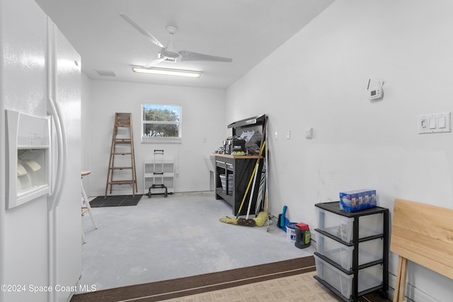 basement with white fridge with ice dispenser