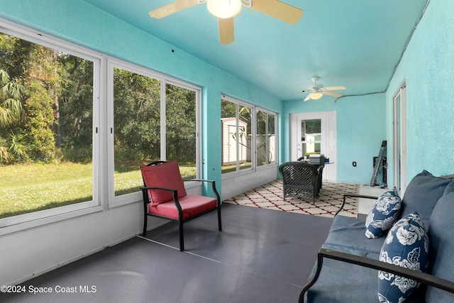 sunroom with ceiling fan and plenty of natural light