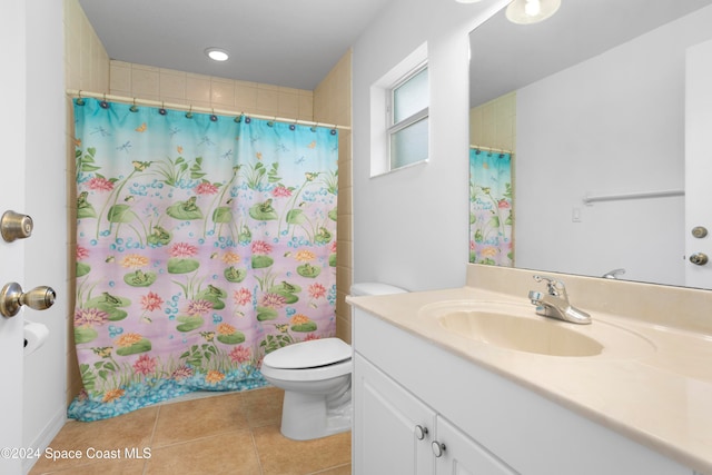 bathroom featuring vanity, toilet, tile patterned floors, and a shower with shower curtain