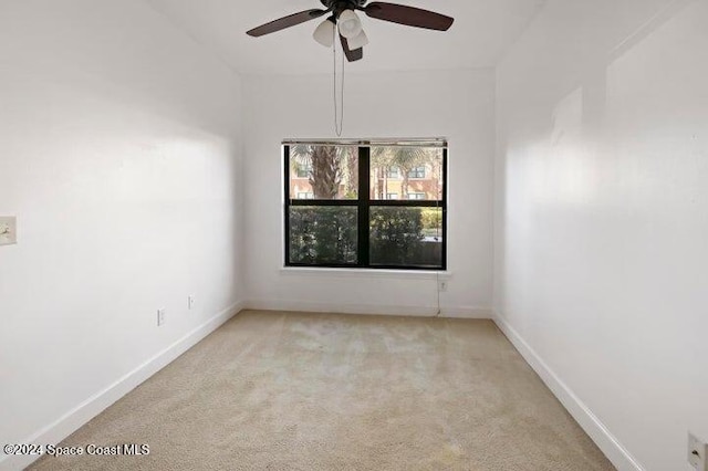 empty room with light carpet and ceiling fan