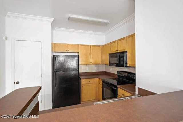 kitchen featuring ornamental molding, decorative backsplash, and black appliances