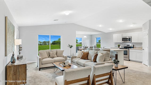 living room featuring vaulted ceiling and light carpet