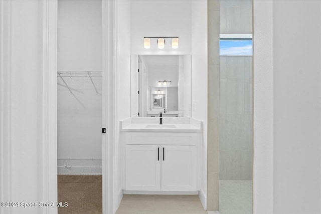 bathroom with a shower and vanity