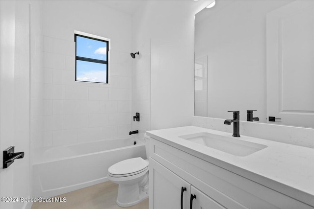 full bathroom featuring vanity, tiled shower / bath combo, and toilet