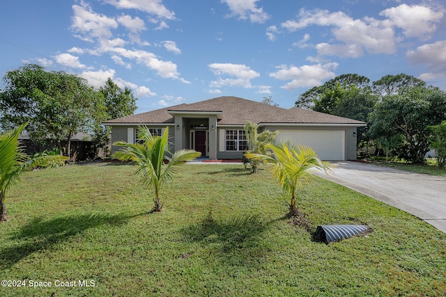 view of front facade featuring a garage and a front lawn