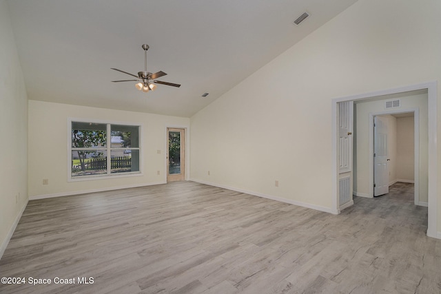 unfurnished living room featuring high vaulted ceiling, light hardwood / wood-style floors, and ceiling fan