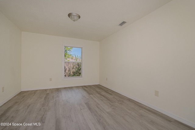 unfurnished room with light hardwood / wood-style floors