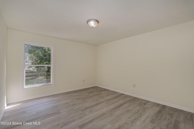 empty room with light hardwood / wood-style floors