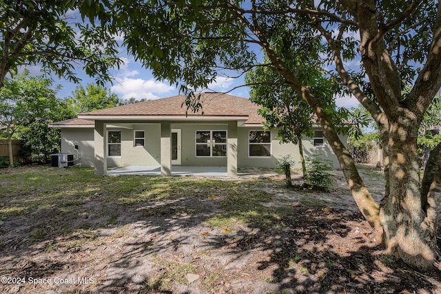 back of property featuring central AC unit and a patio