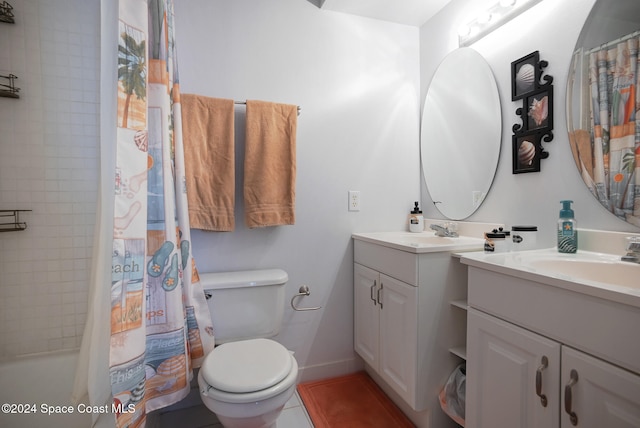 bathroom featuring tile patterned flooring, vanity, and toilet