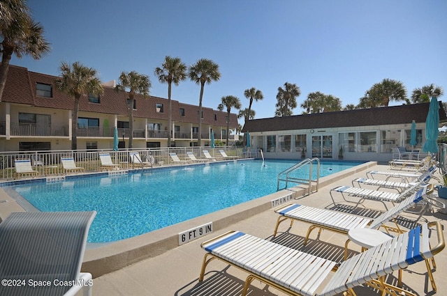 view of swimming pool with a patio area