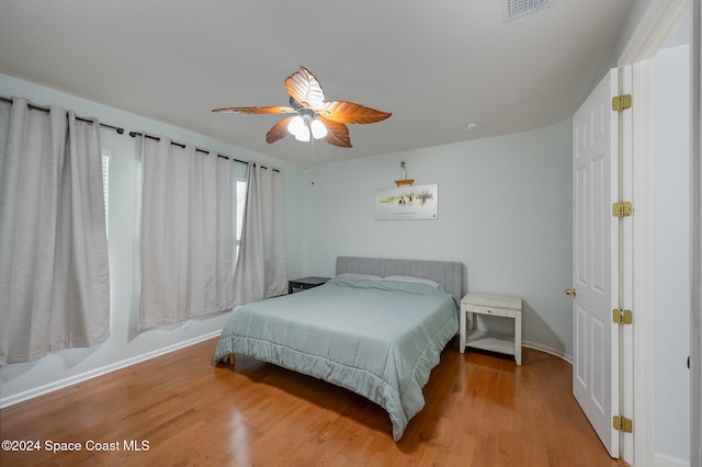 bedroom featuring hardwood / wood-style flooring and ceiling fan