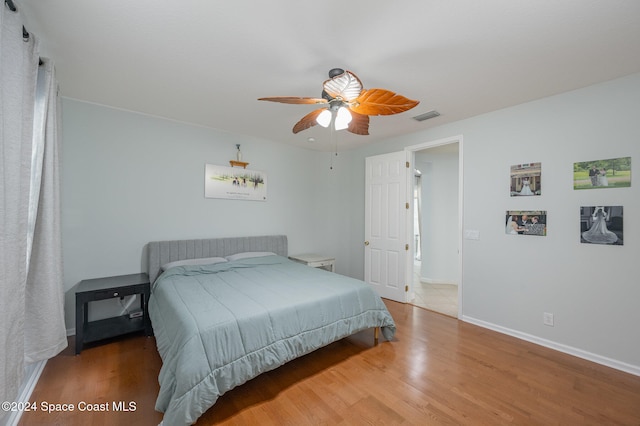 bedroom featuring wood-type flooring and ceiling fan