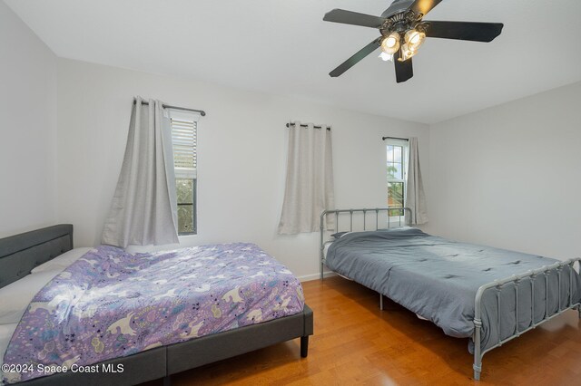 bedroom featuring hardwood / wood-style floors and ceiling fan