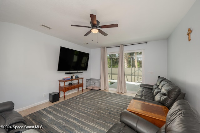 tiled living room with ceiling fan